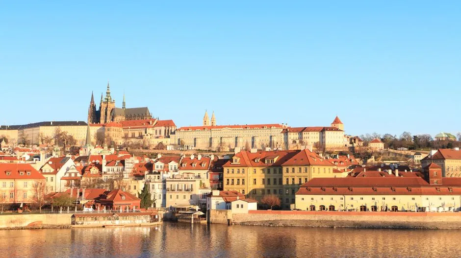 The quiet, historic ramparts of Vyšehrad offer a serene sunset view over the Vltava River away from the downtown crowds.