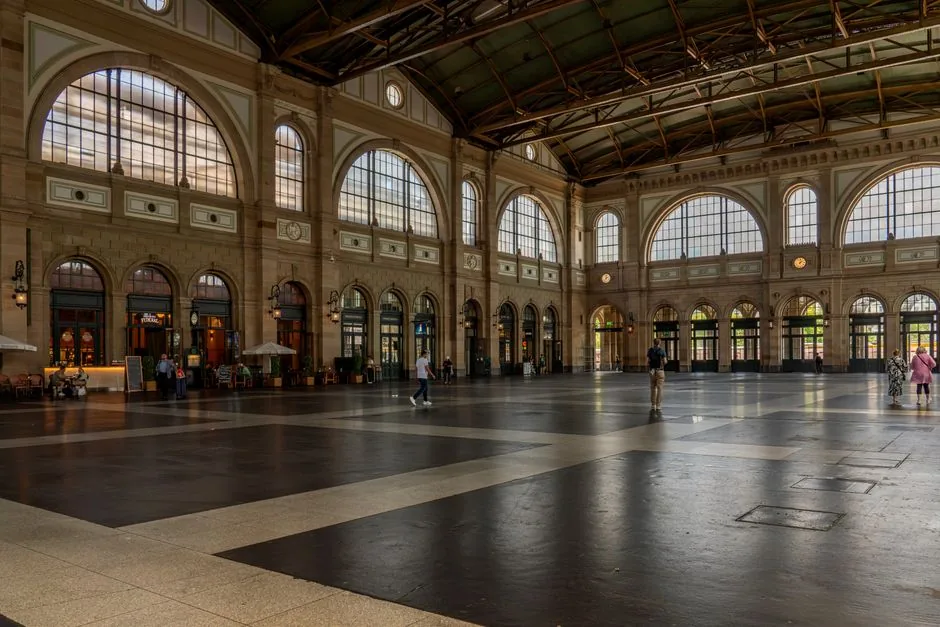 The bustling main hall of Zurich Hauptbahnhof is the primary transport hub connecting the city to the rest of Switzerland.