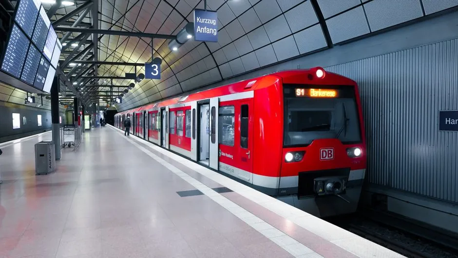 An S-Bahn train arriving at a station in Munich, displaying the line number clearly on the front digital indicator.