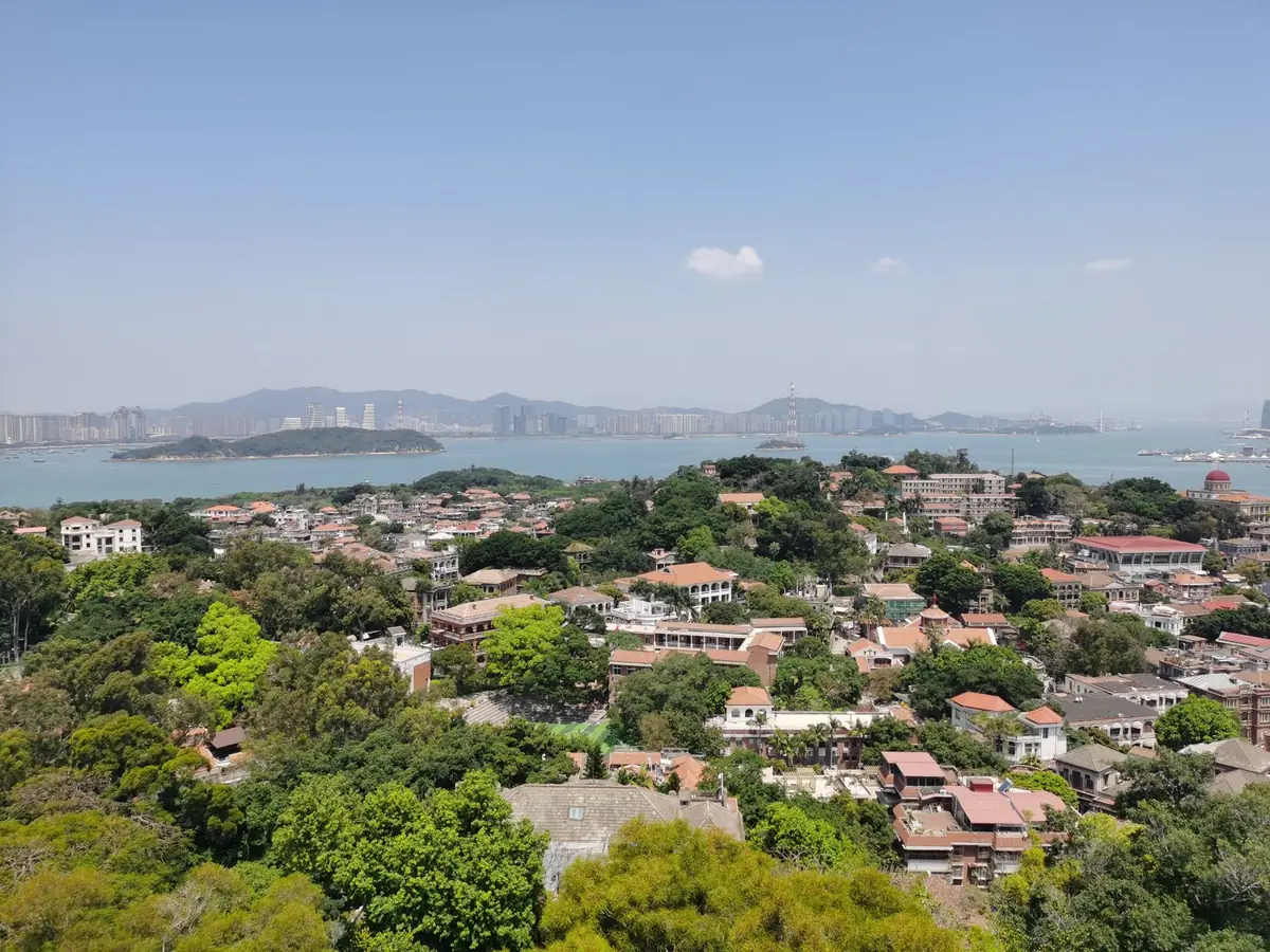 A view of a historic, colorful colonial-era villa on Gulangyu Island, highlighting the unique architectural heritage of the city.