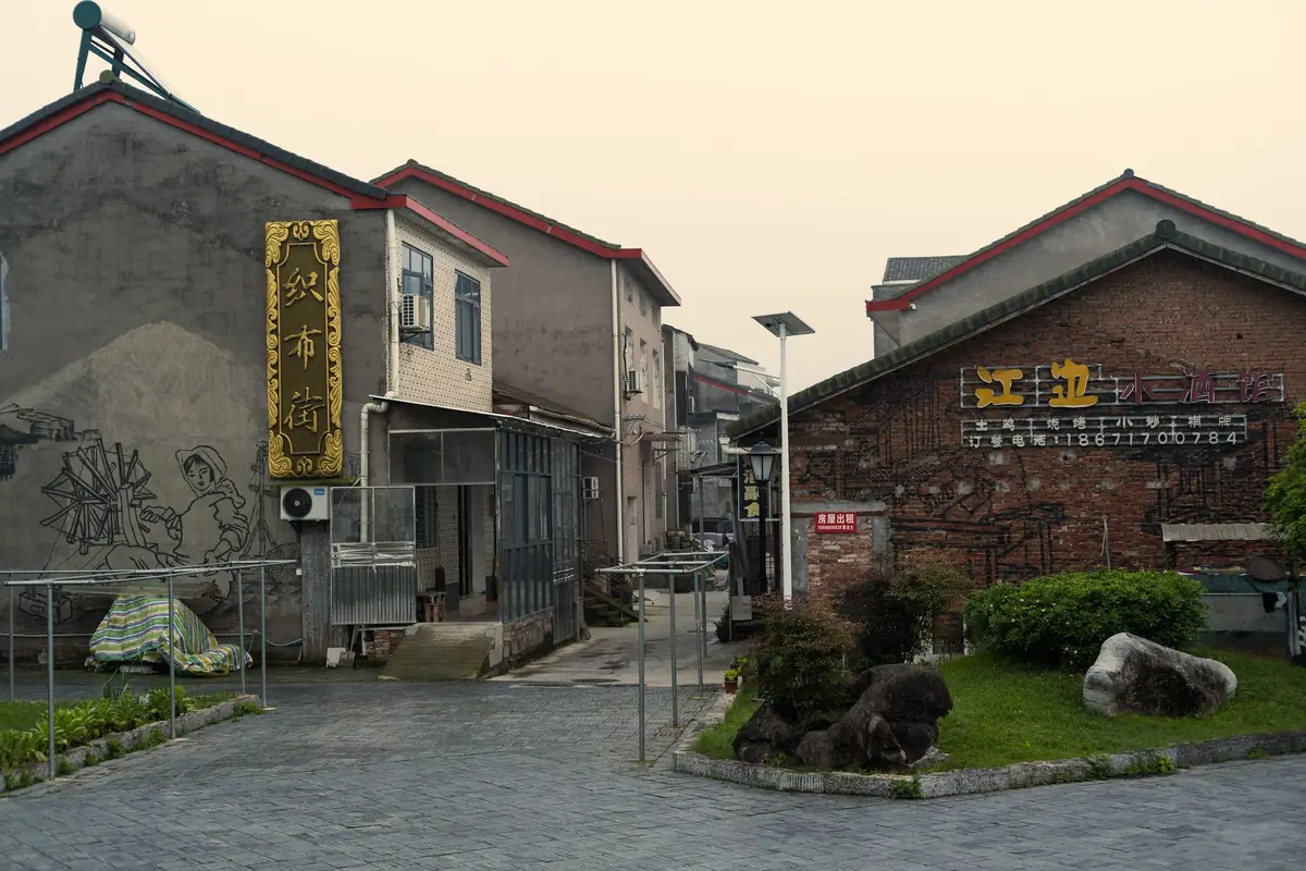 The vibrant, painted walls of a narrow alleyway in the historic Dongpirang district overlooking the sea.