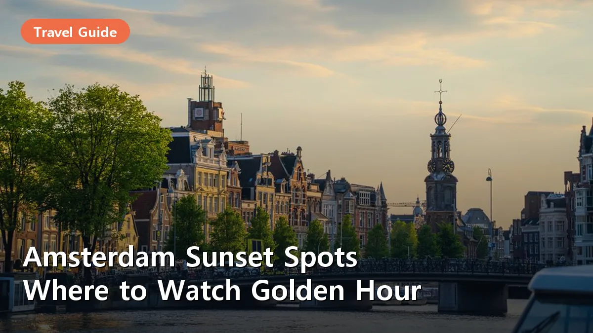 A classic view of an Amsterdam canal at sunset with the bridge silhouette and reflected golden light.